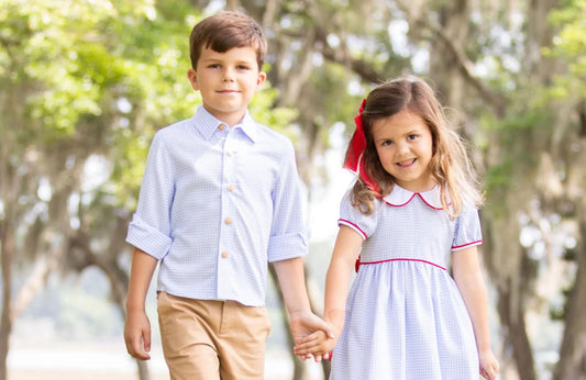 brother and sister holding hands walking