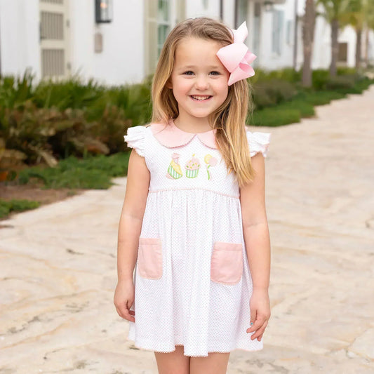 little girl in pink bow and party dress