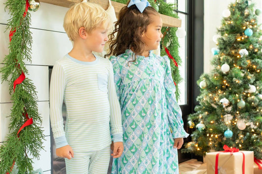 little boy and girl in kids Christmas pajamas