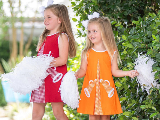 2 little girls in dresses with applique megaphones - kids game day outfits