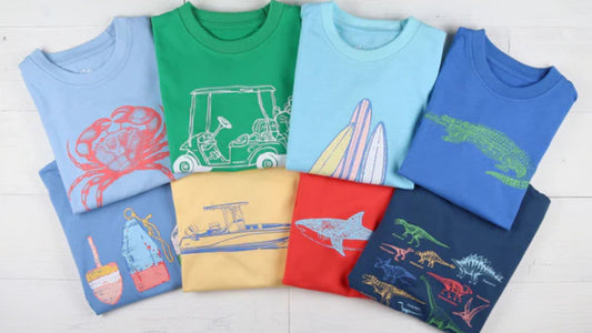 8 graphic tees laid out in two row