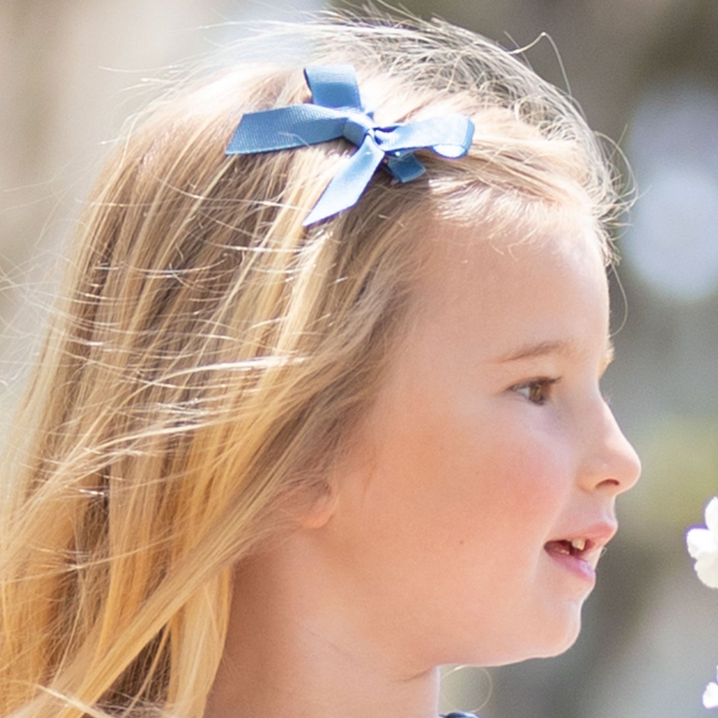 little girl wearing a Blueberry Bitty Bow