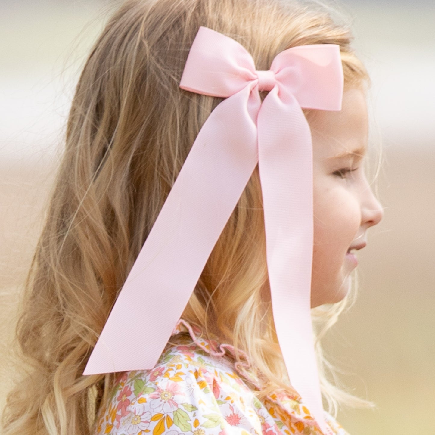 little girl wearing Blush Birdie Bow