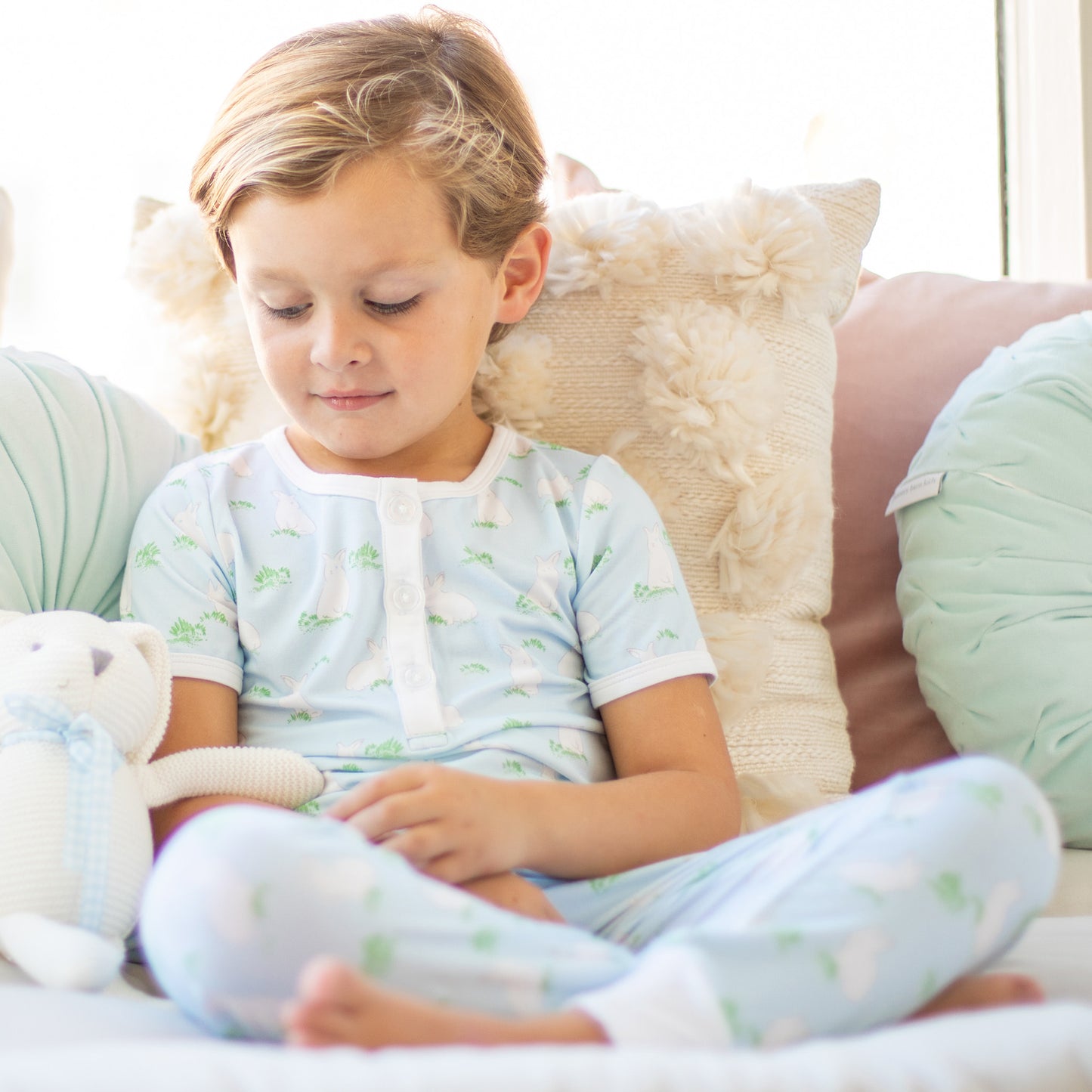 little boy sitting on a couch wearing Hippity Hoppity Blue Lounge Set