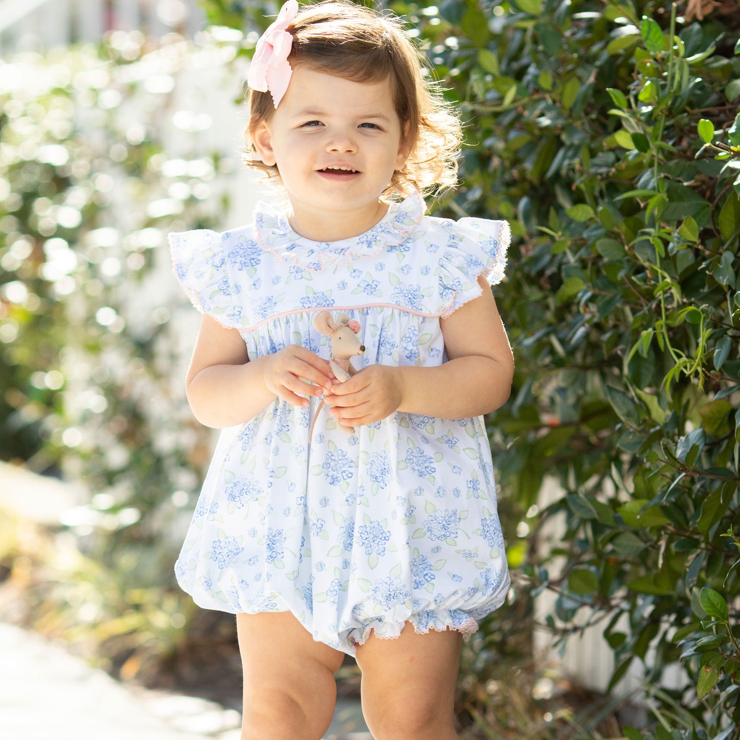 little girl wearing a Girls Garden Party Bubble