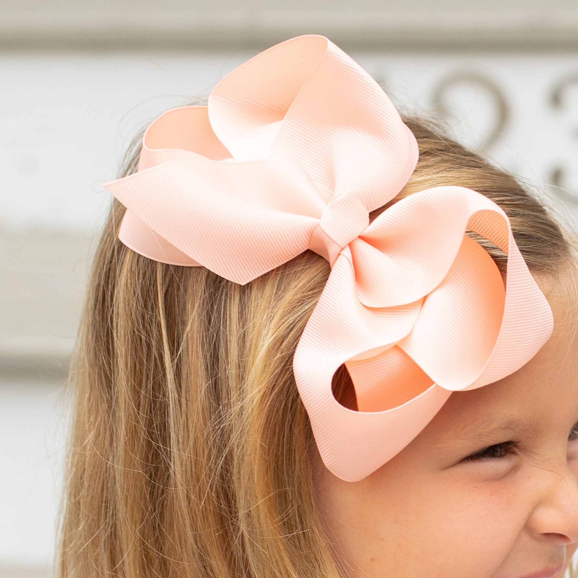 little girl wearing a Moonstone Biggie Bow