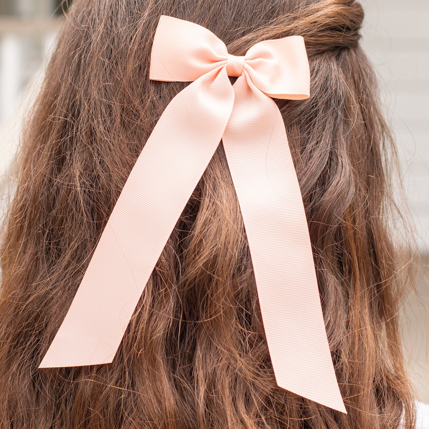 little girl wearing a Moonstone Birdie Hair Bow