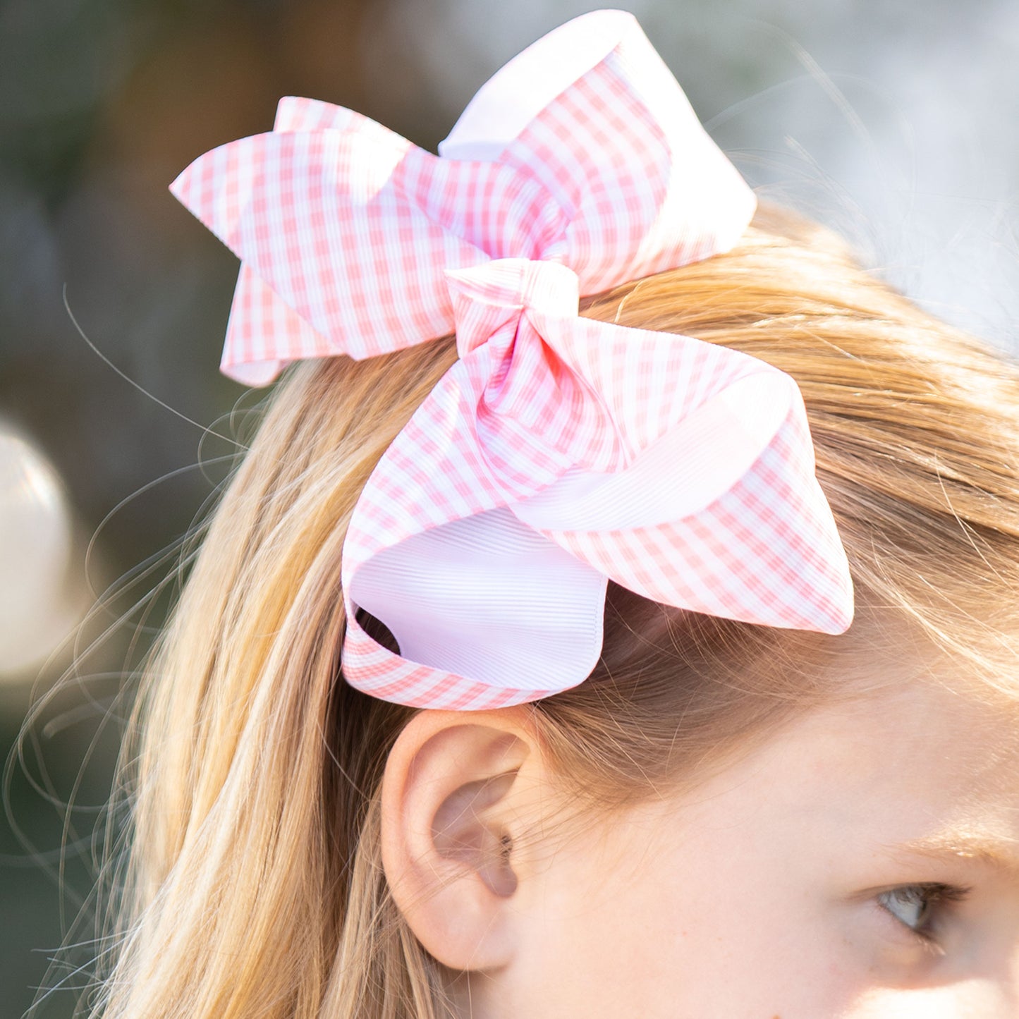 little girl wearing a Pink Check Biggie Bow