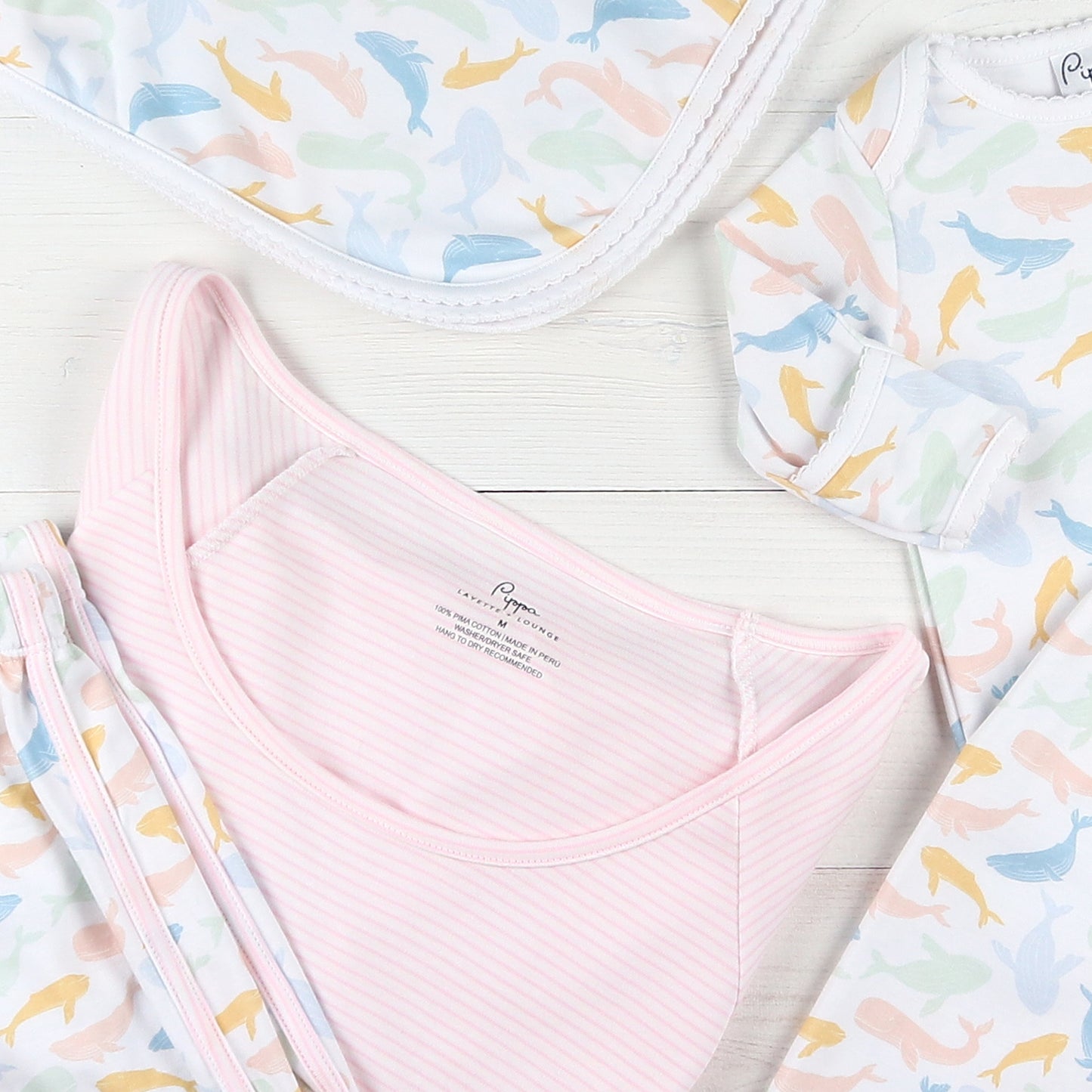 flatlay of baby pajamas and blanket