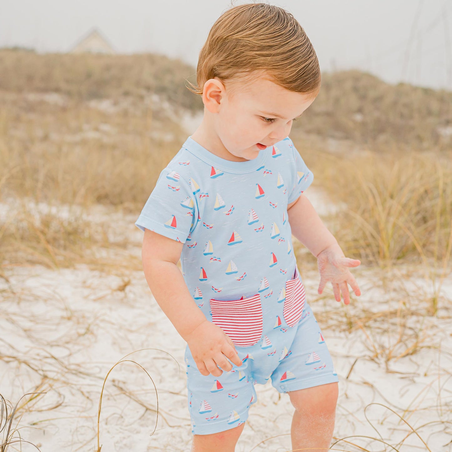 little baby walking at the beach