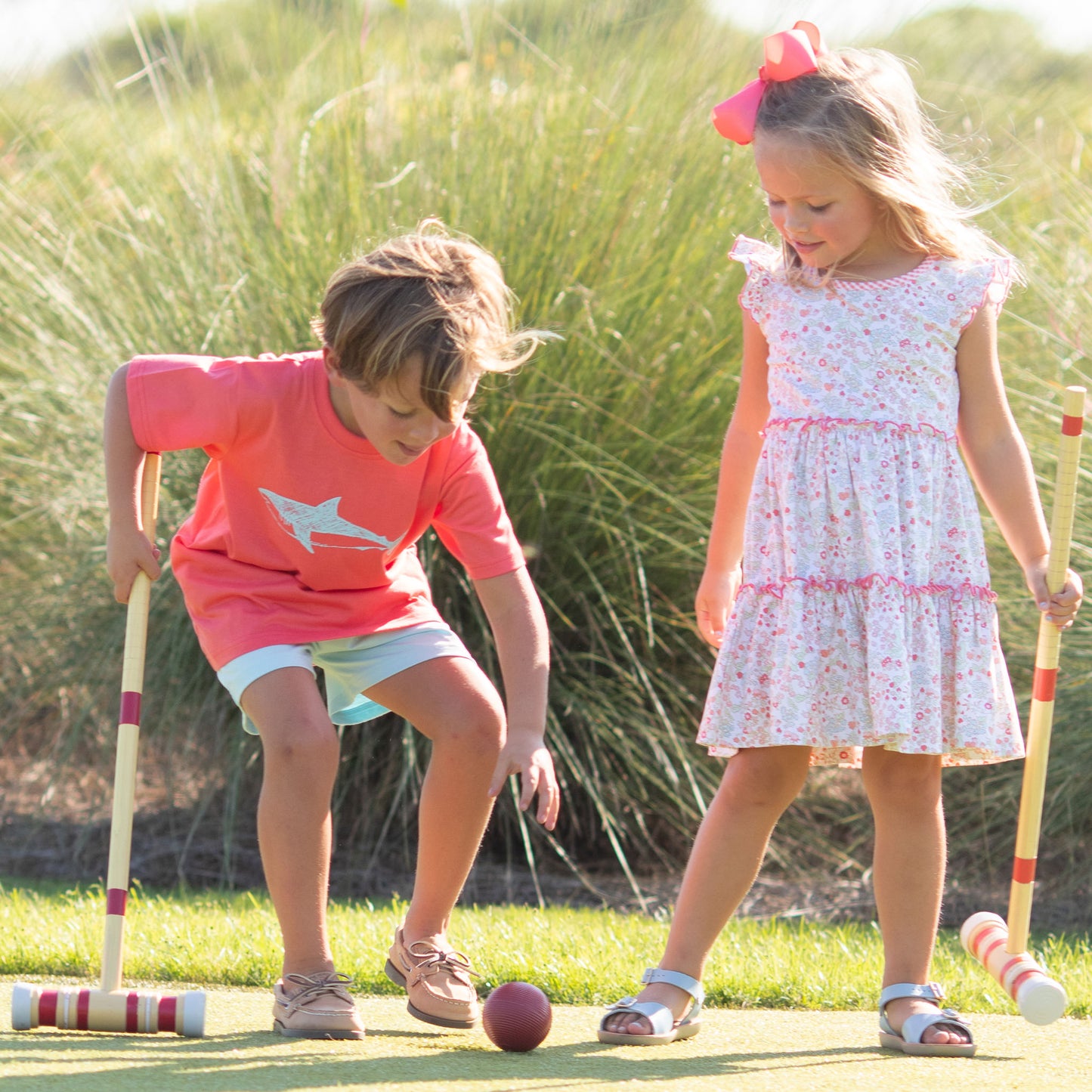 boy and girl in Spring Fling Tier Dress playing croquet