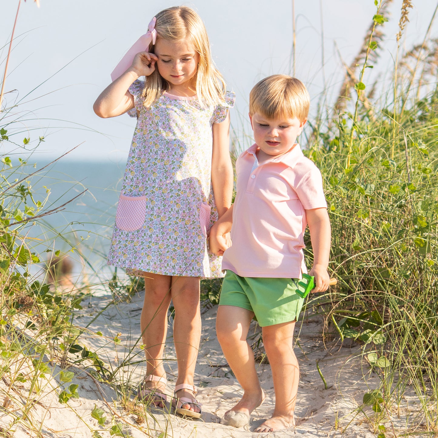 little boy and girl holding hands