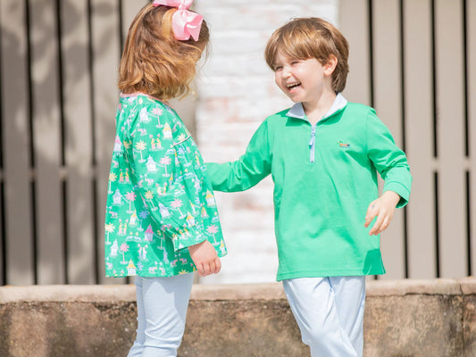 boy and girl laughing and smiling in matching sibling clothing outfits