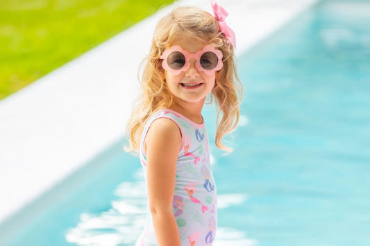 little girl in daisy sunglasses and bathing suit at the pool - kids bathing suits