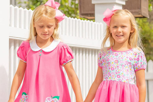 siblings in pink dresses - kids clothes sale