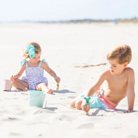 2 kids playing at the beach - kids summer clothing