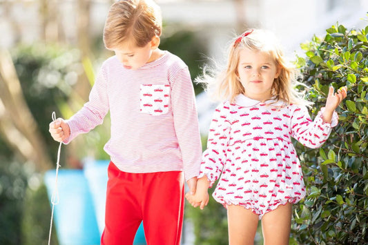 little boy and girl in pima cotton Christmas outfits