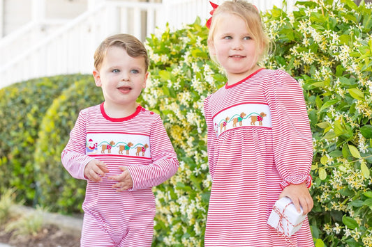 little boy and girl in matching Christmas clothing - Smocked Christmas Outfits