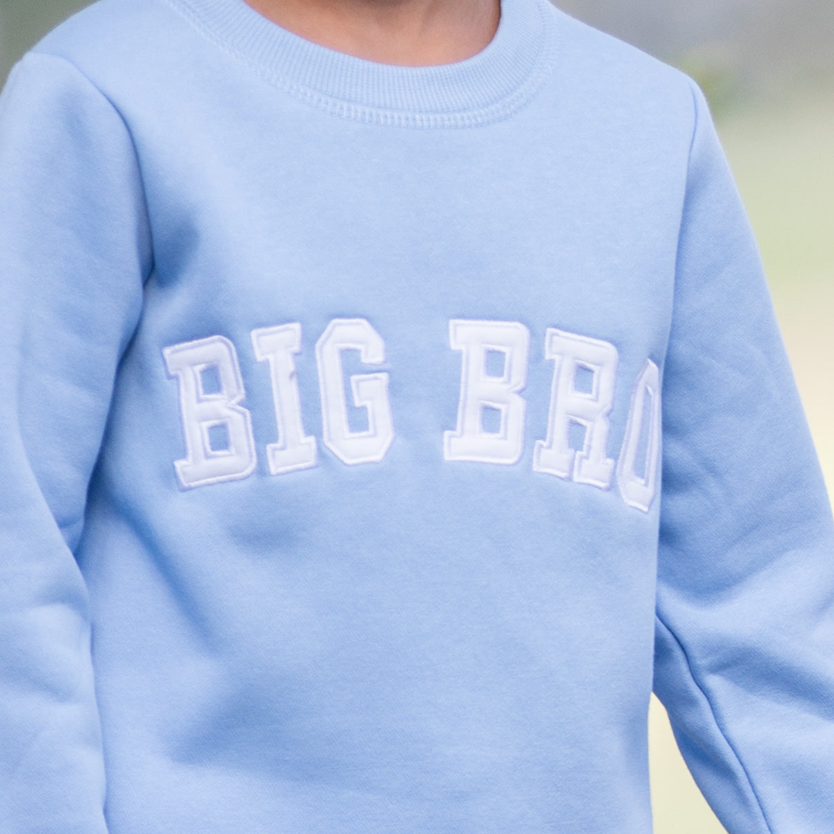 Close-up of Big Bro Sweatshirt with white applique