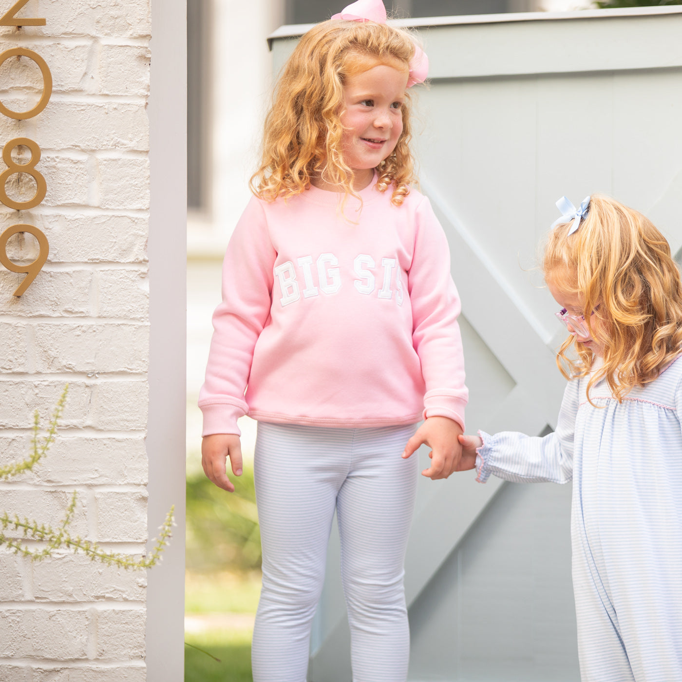 Close-up of Big Sis Sweatshirt with white applique