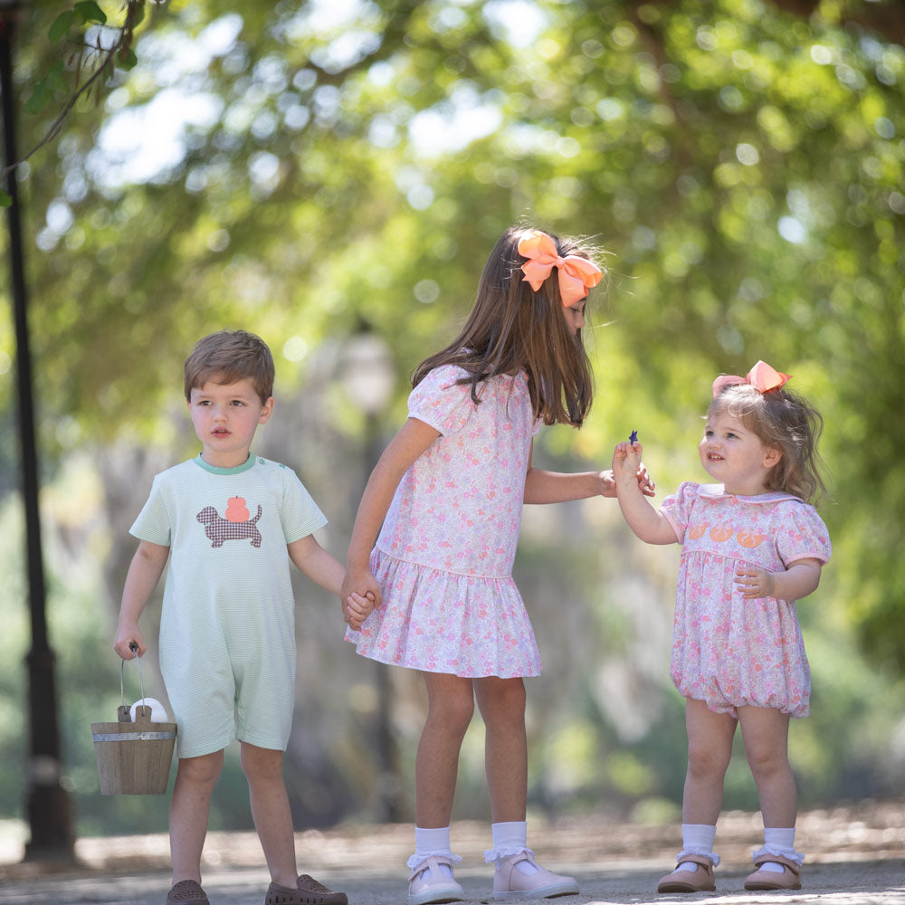 Matching sibling styles featuring Pumpkin Paws Romper