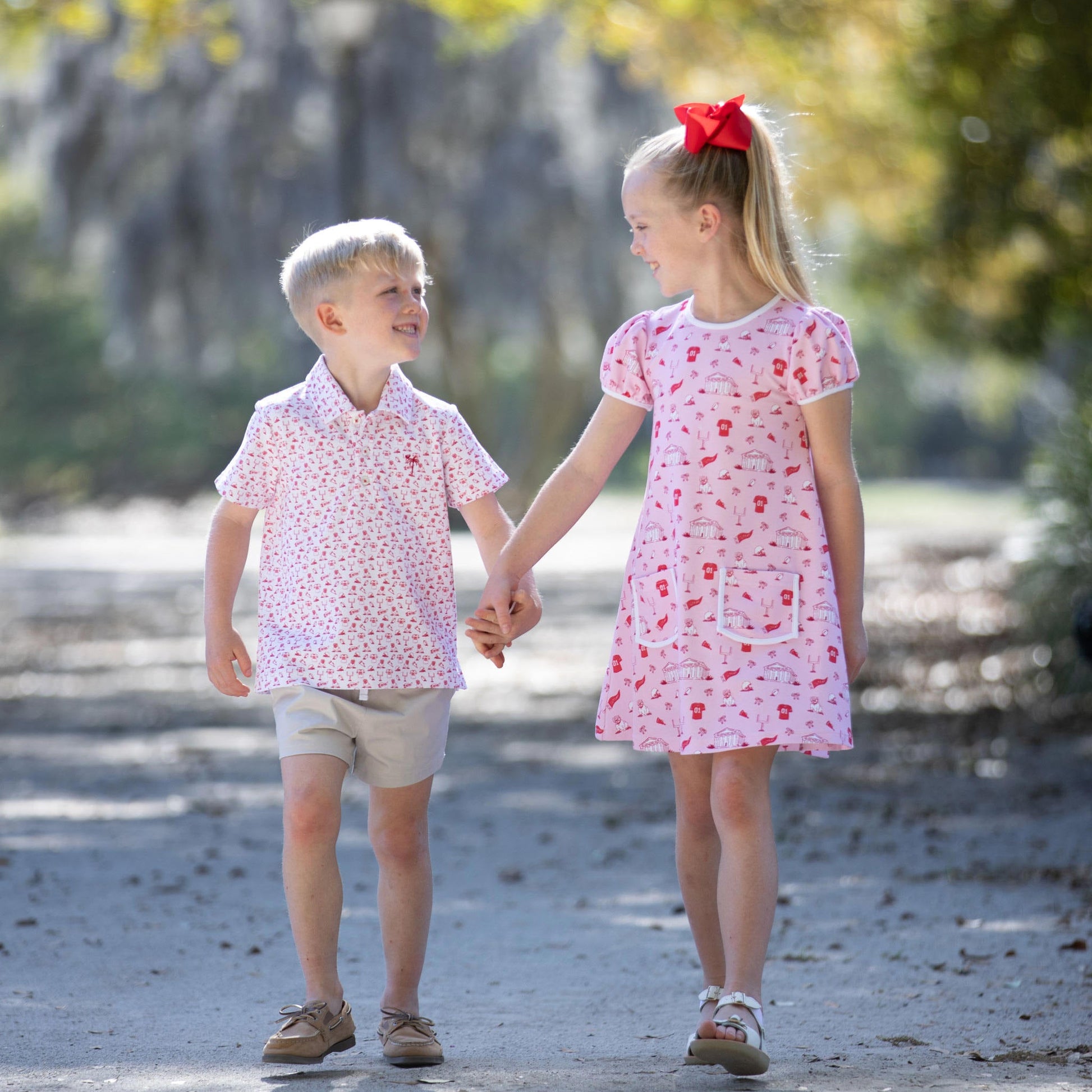 Matching sibling styles featuring Varsity Spirit Polo