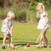 Load image into Gallery viewer, little girl wearing Kiawah Pink Smocked Alligator Set playing croquet with her brother