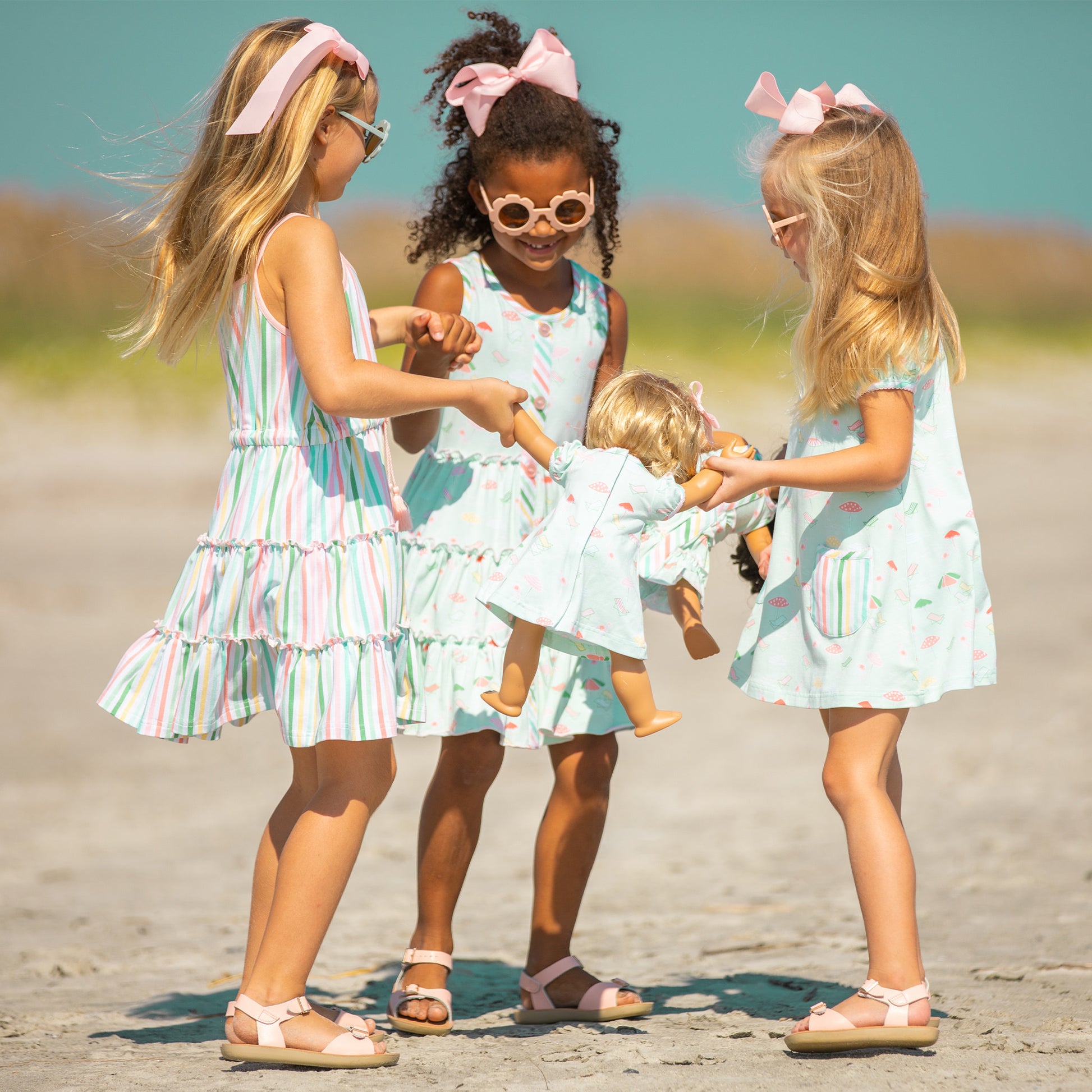 three little girls on the beach with a doll wearing Beach Club Play Dress