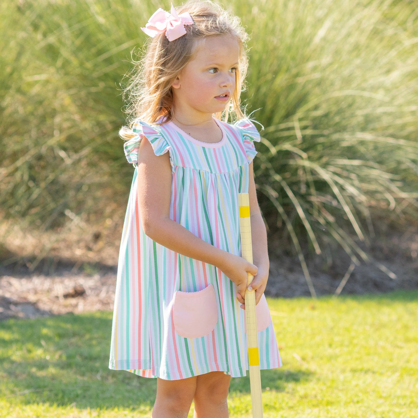 little girl wearing Beach Club Stripe Flutter Play Dress