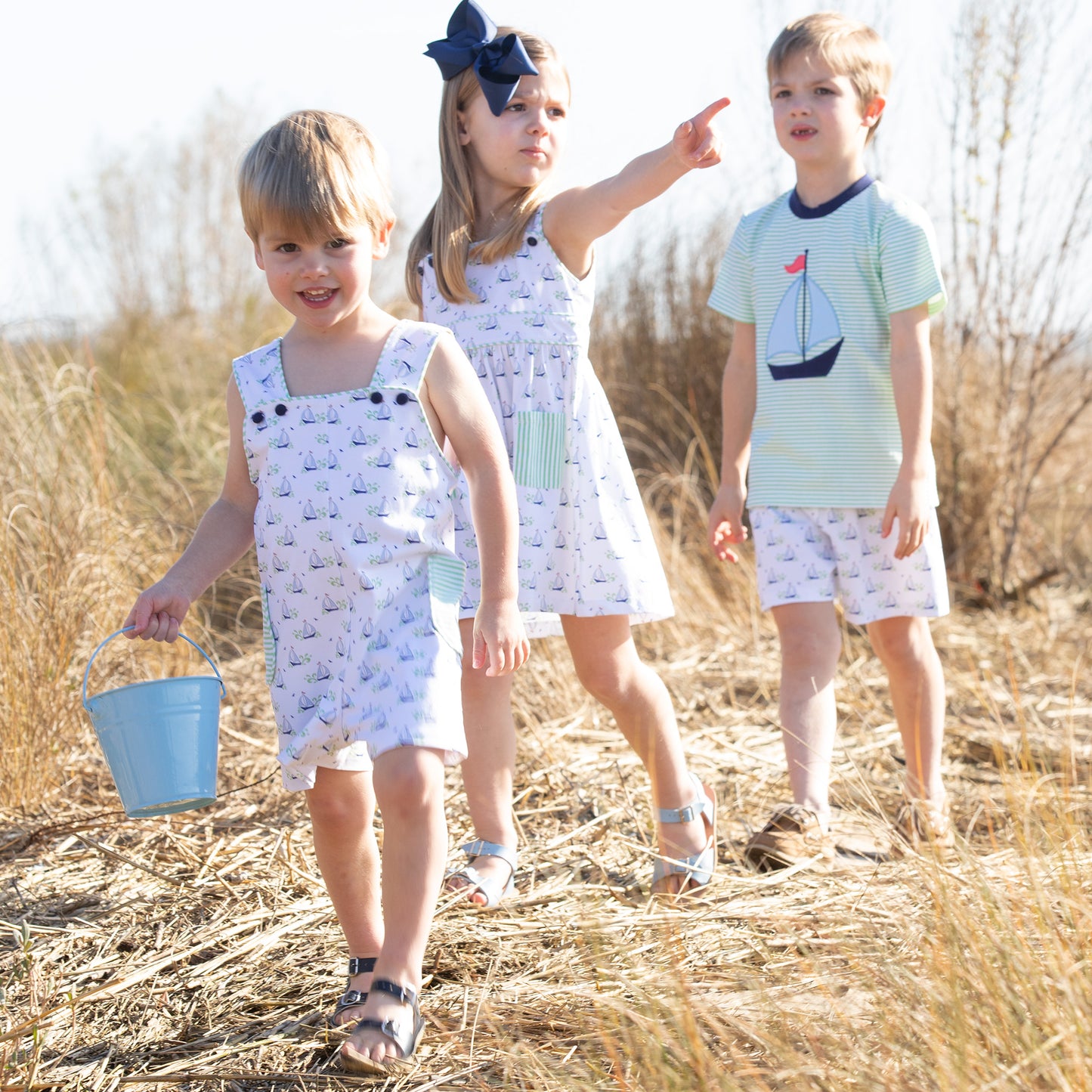 2 little boys and little girl on the beach wearing Beneteau Pocket Dress