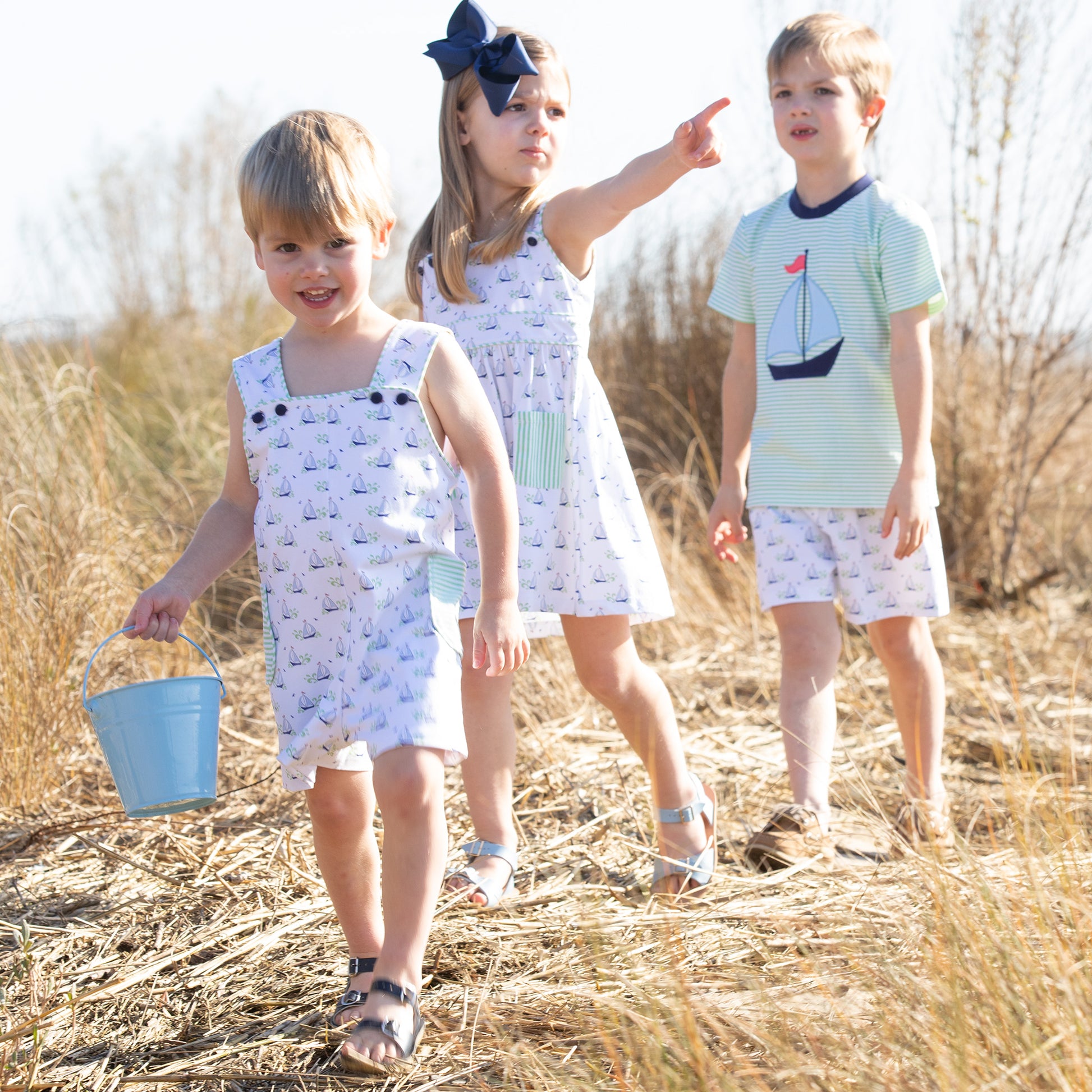 2 little boys and little girl on the beach wearing Beneteau Pocket Dress