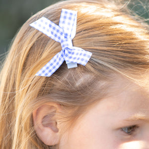 little girl wearing Blue Check Bitty Bow in her hair