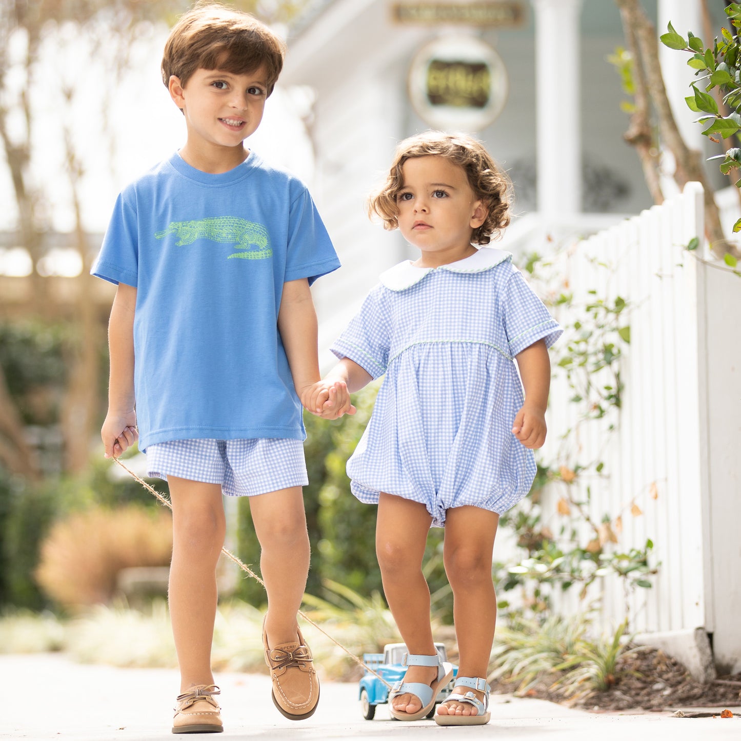 two little boys walking down the street, one wearing Blue Check Knit Shorts