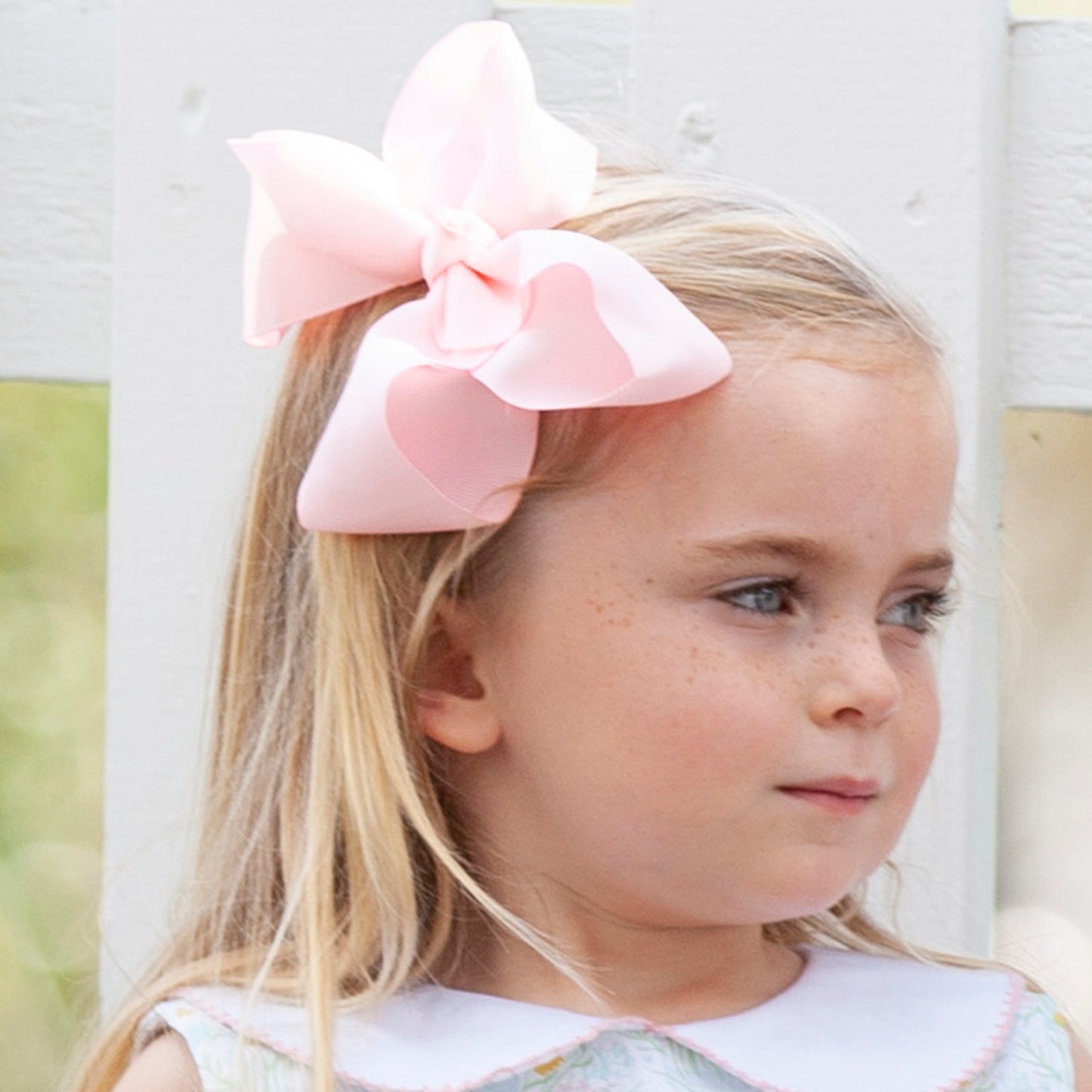 little girl wearing the Blush Biggie Bow