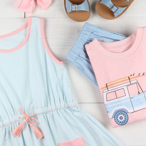 flatlay of Tennis Club Jordan Dress, light blue shorts, tshirt