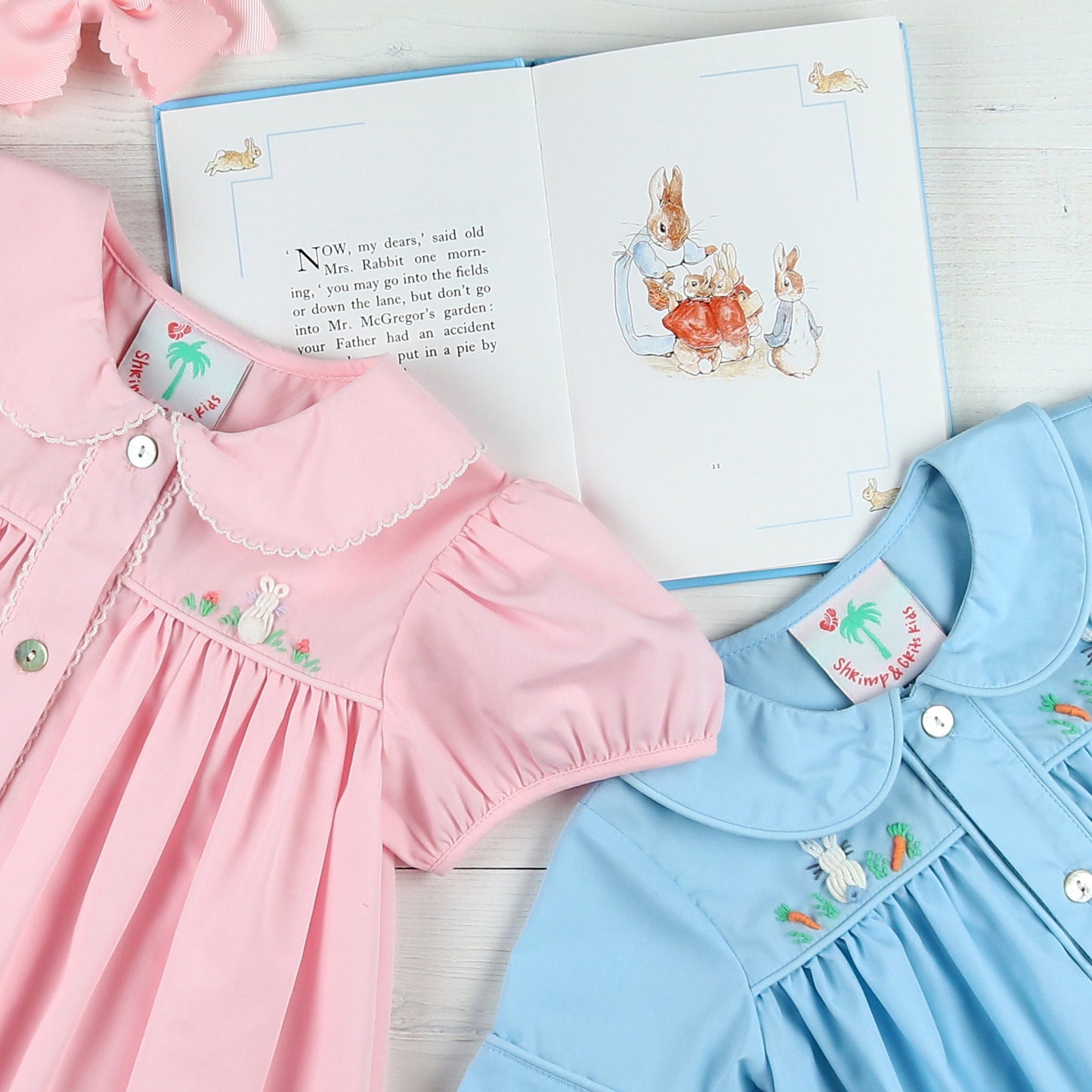flatlay of a pink Easter dress, Easter book and Hippity Hoppity Embroidered Bubble