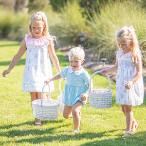 2 little girls and a little boy in Briggs Blue Knit Romper Bubble carrying easter baskets