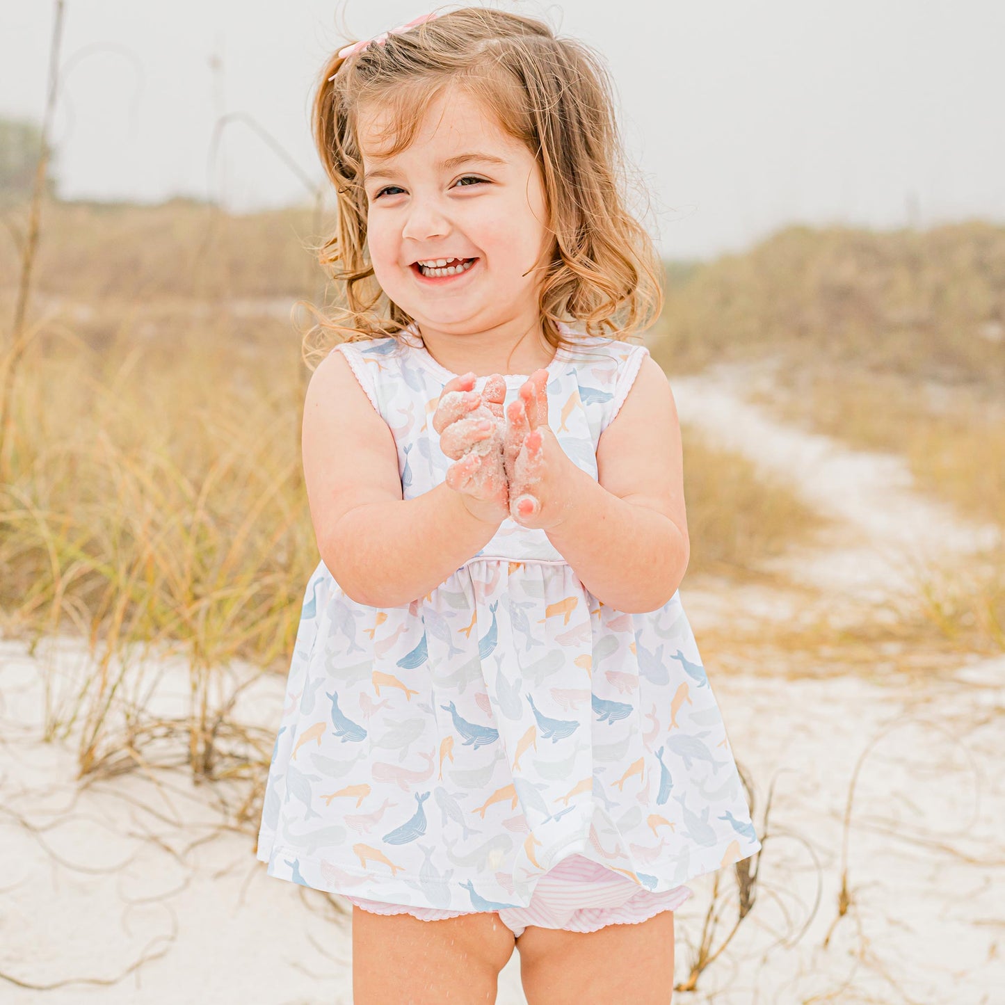 little girl playing at the beach wearing Colorful Whale Pima Flowy Set