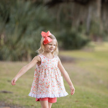 Load image into Gallery viewer, little girl walking in a park wearing an oranges printed top