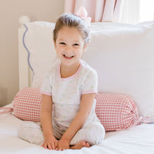 Load image into Gallery viewer, little girl sitting on her bed in her pajamas