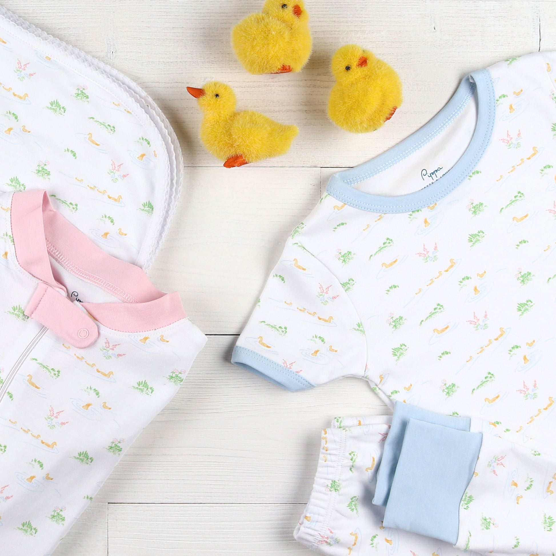 flatlay of soft cotton baby pajamas