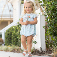Load image into Gallery viewer, little girl holding cloth flowers standing on the sidewalk smiling