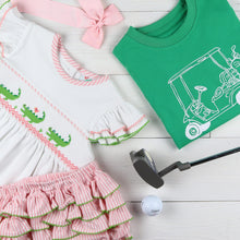 Load image into Gallery viewer, flatlay of green shirt with golf club and pink bow