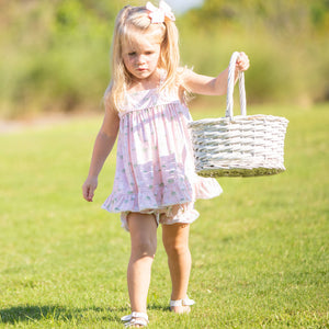 little girl wearing Hippity Hoppity Knit Set holding an Easter basket