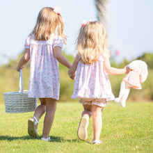 Load image into Gallery viewer, two little girls in dresses walking through the grass holding an Easter bunny and Easter basket