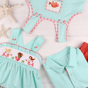 flatlay of childrens summer clothes