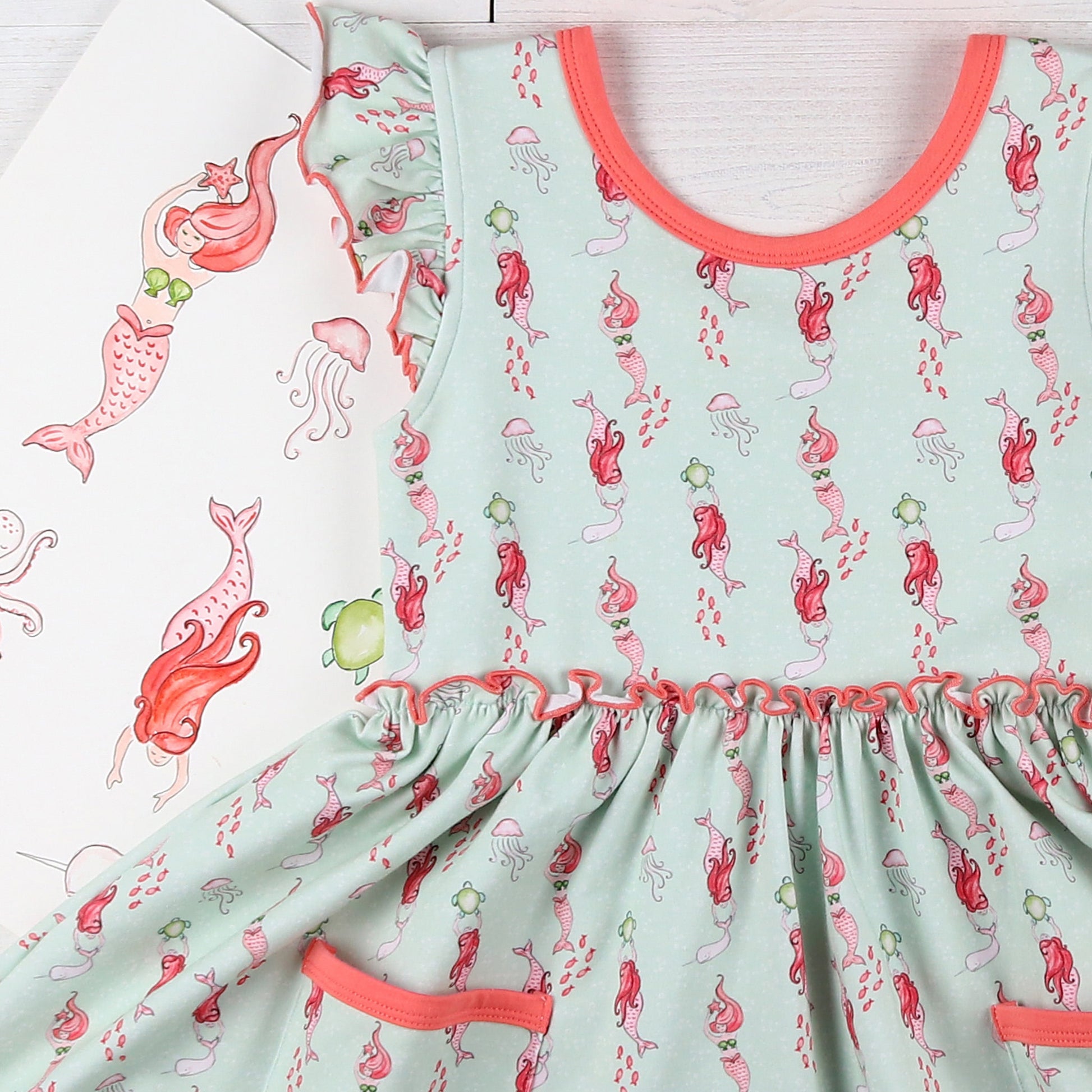 flatlay of childrens summer clothes