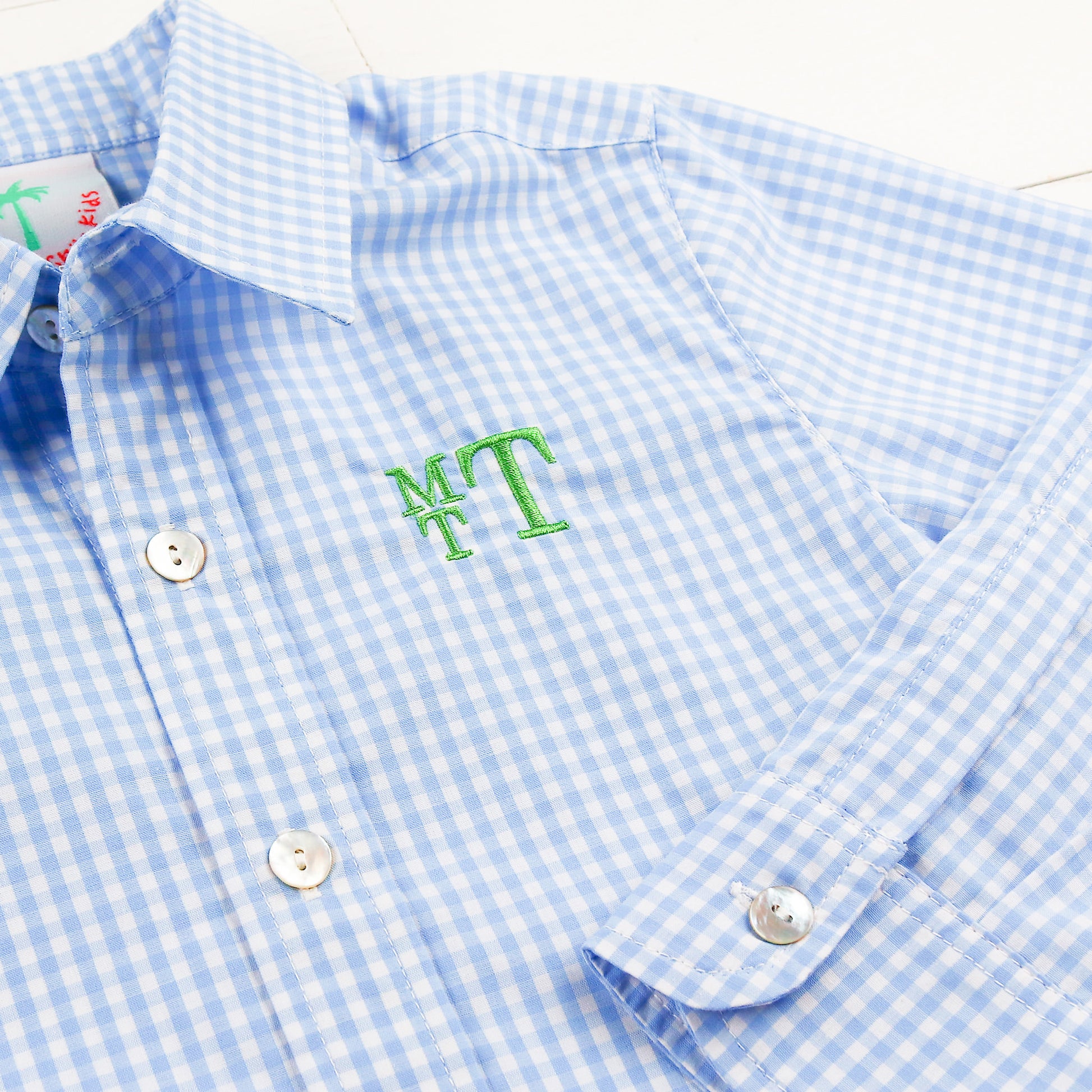 close up of monogram on Sunny Blue Gingham Oxford