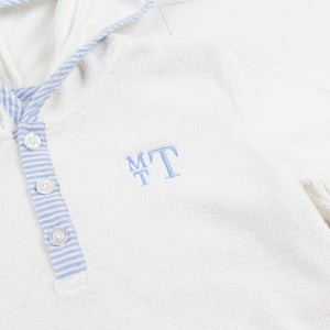 close up of monogram on a beach cover up