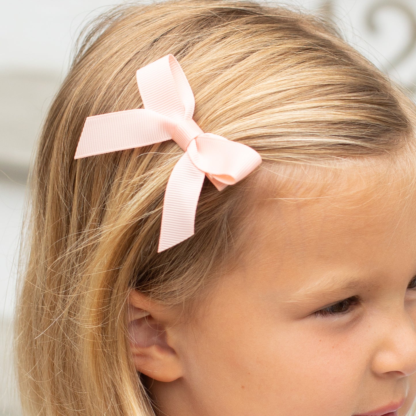 little girl wearing a Moonstone Bitty Bow